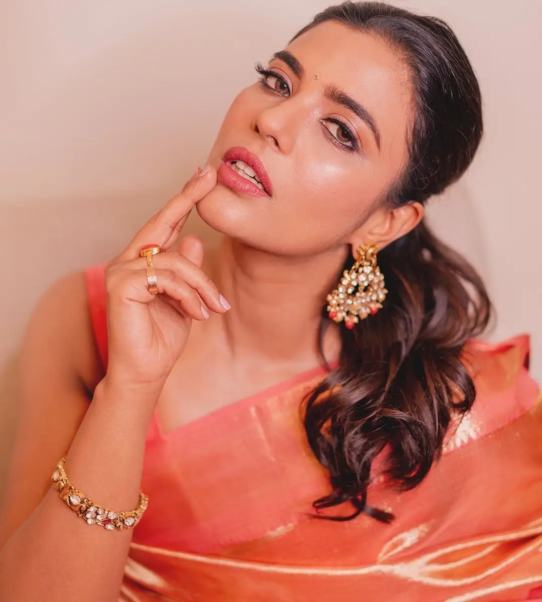 Indian Actress Aishwarya Rajesh in Orange Pattu Saree Blouse